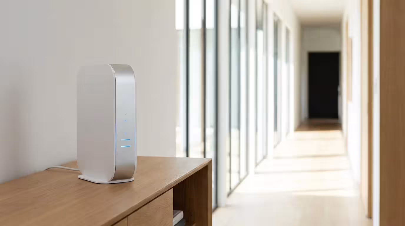 Modern WiFi router on a console table in a minimalist home.